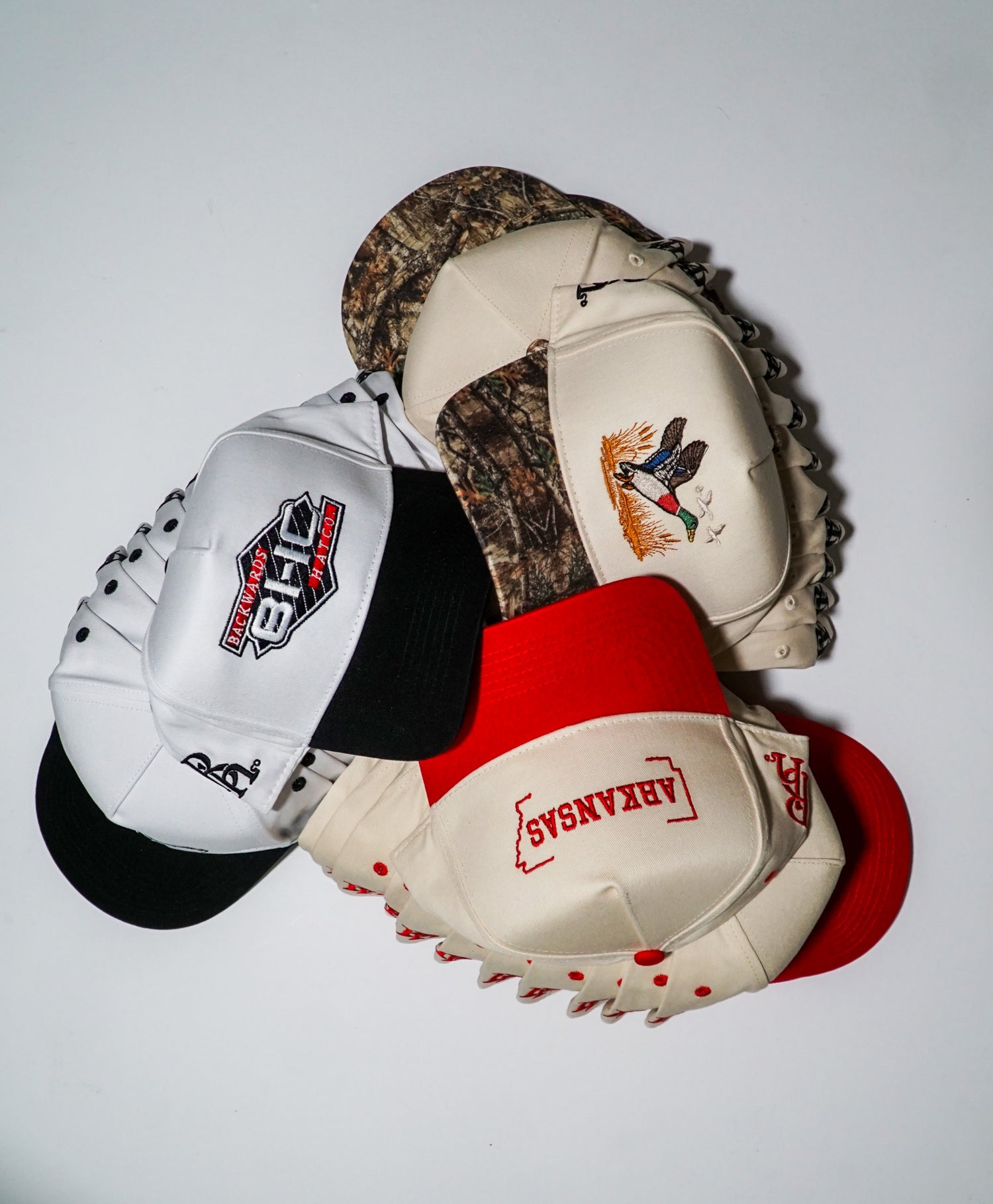 Collection of custom snapbacks such as hunting hats, state hats, and brand hats